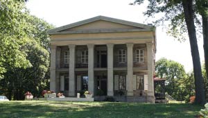 A picture of the front exterior of Baker Mansion.