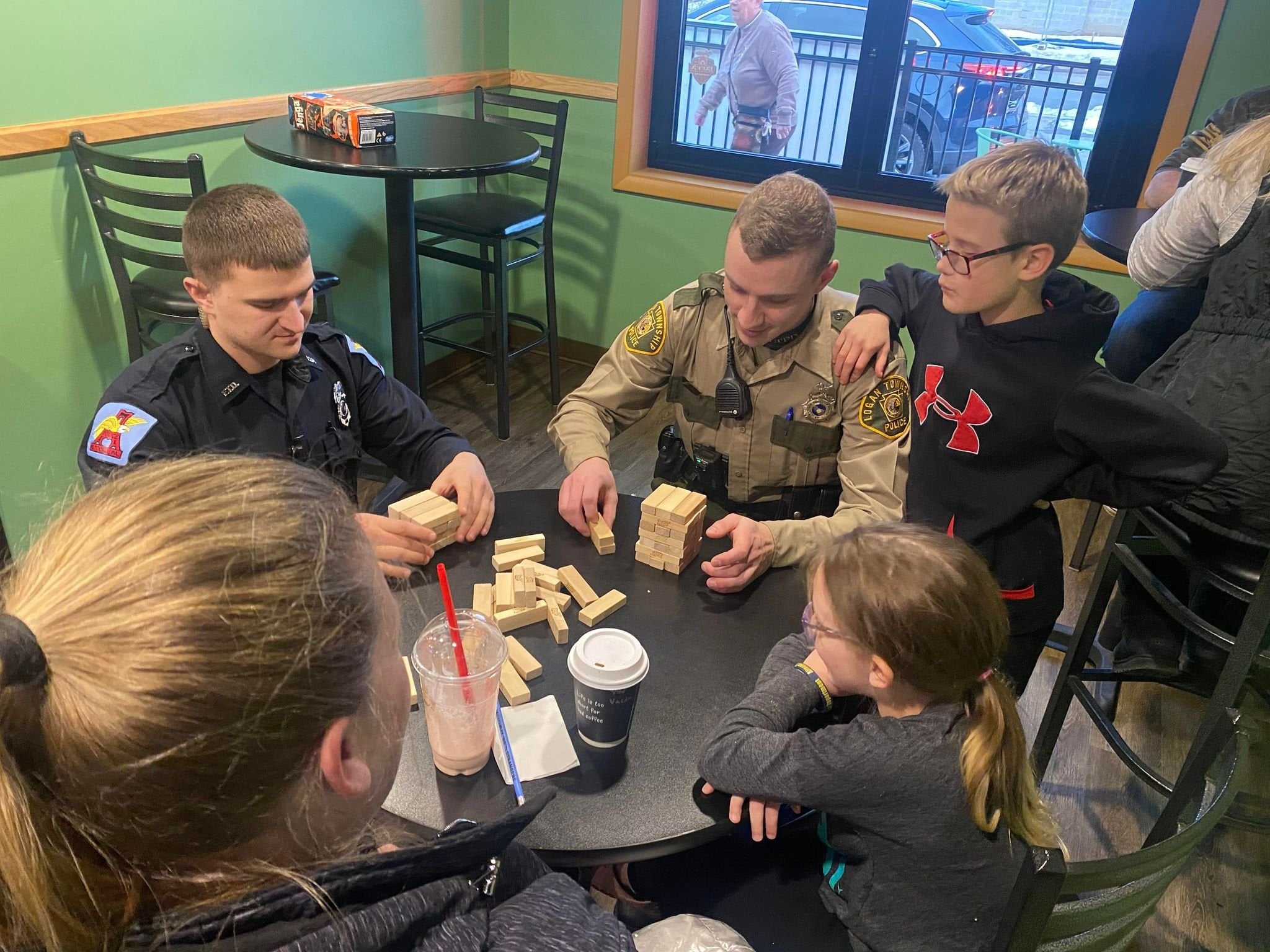 Officers playing a game with children.