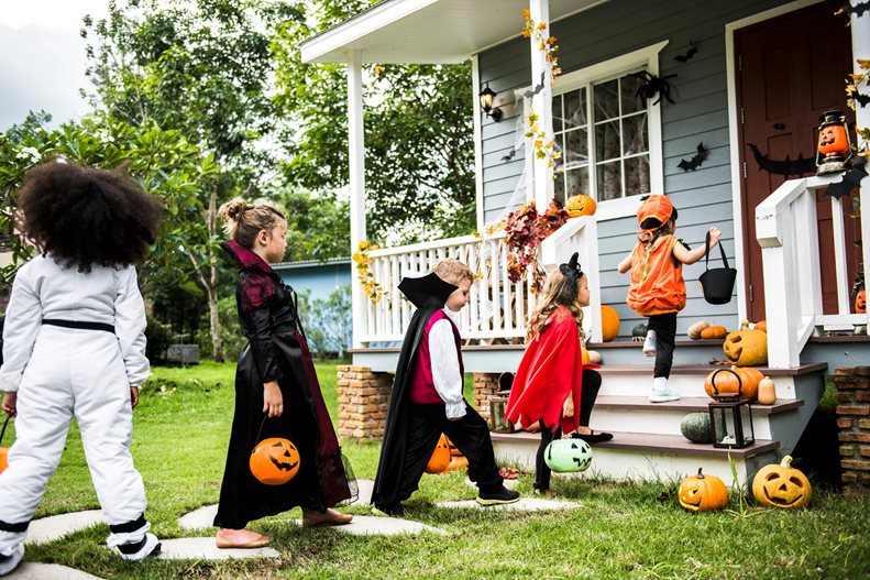 Picture of kids tick-or-treating.